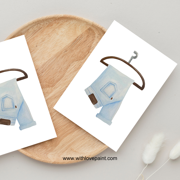 Small fabric house on a hook with a wooden plate and white background