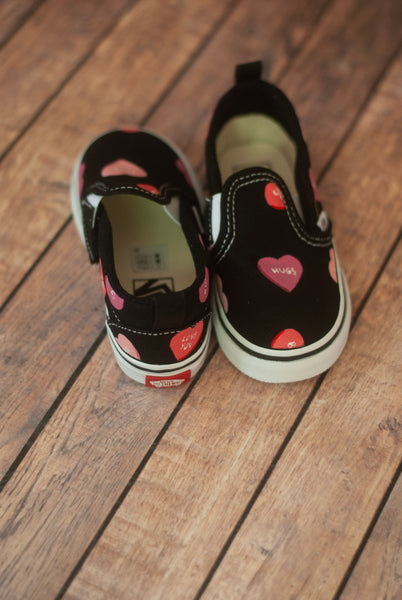 handpainted convo hearts on black slip on vans 