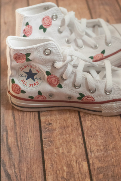 white converse with pink roses painted on