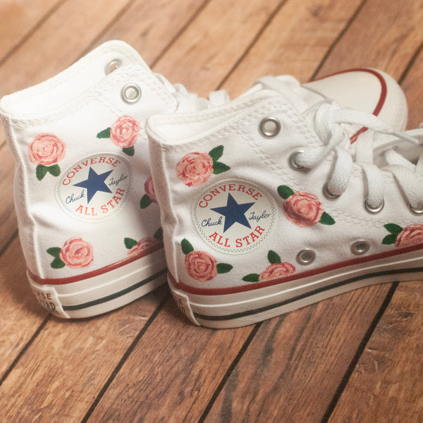 white converse with pink roses painted on