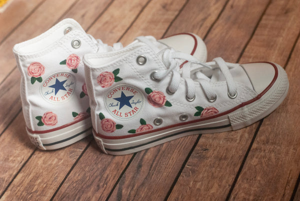 white converse with pink roses painted on