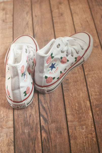 white converse with pink roses painted on