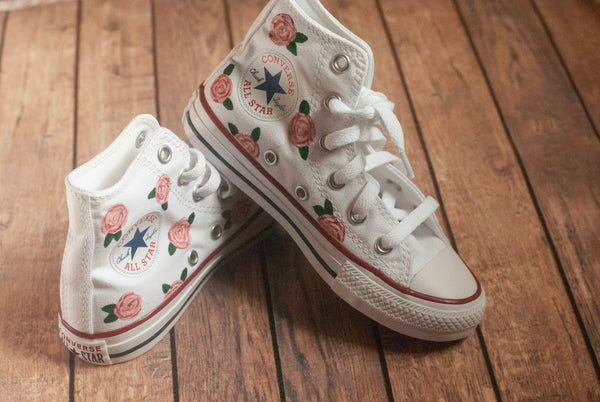 white converse with pink roses painted on
