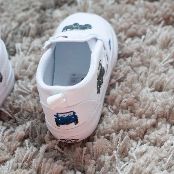 slip on vans painted with little cars. 
