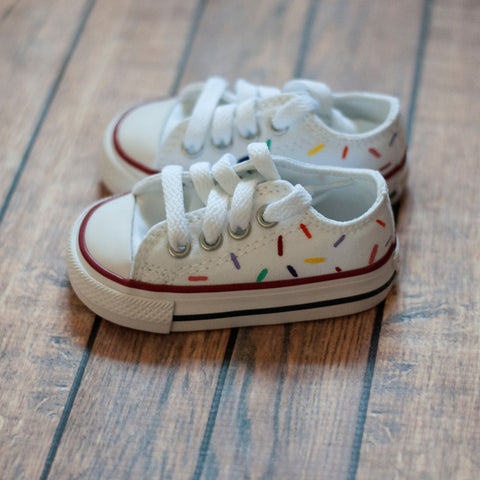 white converse with color sprinkles hand painted on